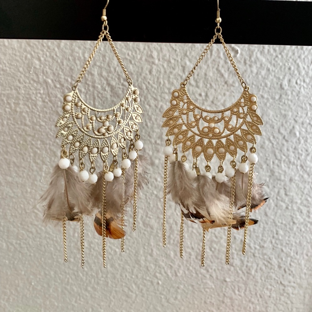 Gold feathered earrings